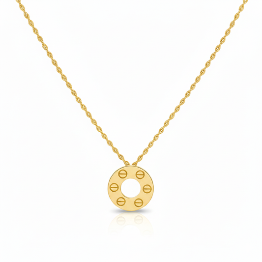 Gold necklace with a circular pendant on a white background