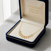 Gold necklace in an open jewelry box with 'Embellish Gold Jewelry & Diamond' branding.