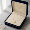 Gold necklace with 'LOVE' pendant in a 'Embellish Gold Jewelry & Diamond' box.