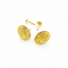 Oval gold stud earrings with embossed woman face design on white background