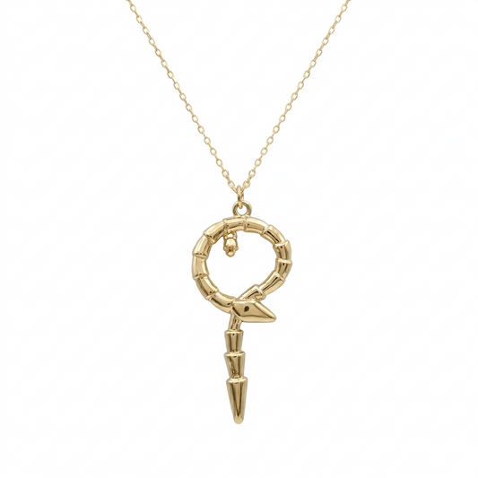 Gold necklace with a unique pendant on a white background