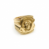 Gold ring with a detailed design on a white background