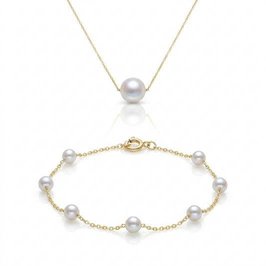 Gold bracelet with pearls on a white background