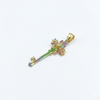 Gold key-shaped pendant with a colorful gemstone on a white background