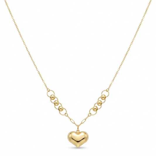 Gold heart-shaped pendant necklace on a white background