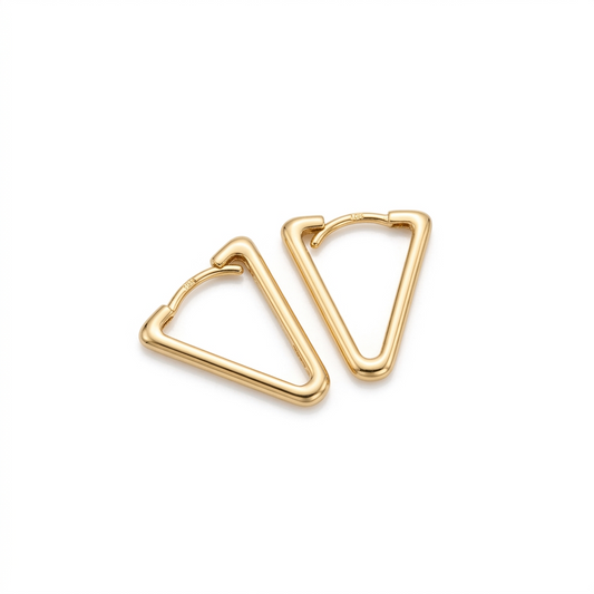 Gold triangle-shaped earrings on a white background