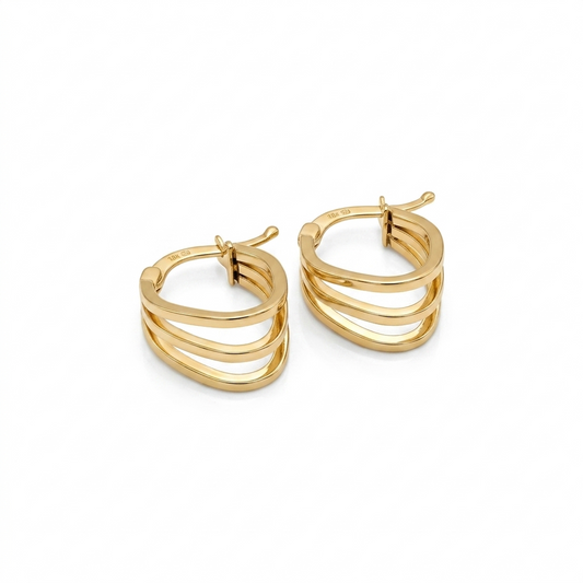 Gold hoop earrings on a white background