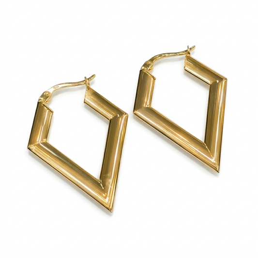 Gold hoop earrings on a white background