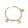 Gold chain bracelet with heart and clover charms on a white background