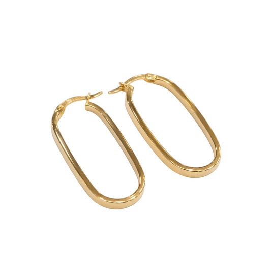 Gold hoop earrings on a white background