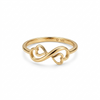 Gold ring with heart and infinity design on a white background