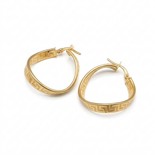 Gold hoop earrings on a white background