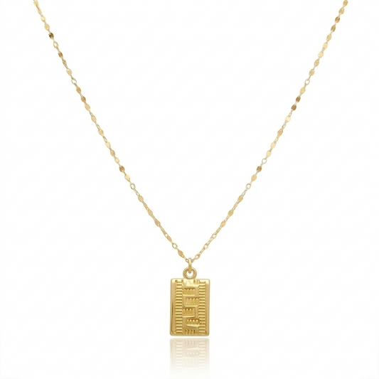 Gold necklace with a rectangular pendant on a white background