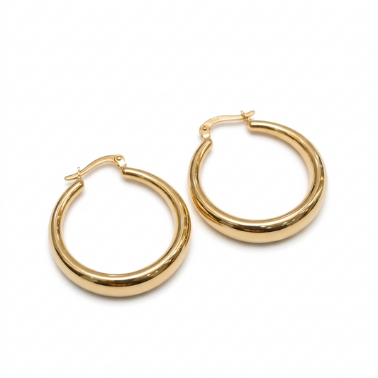 Gold hoop earrings on a white background