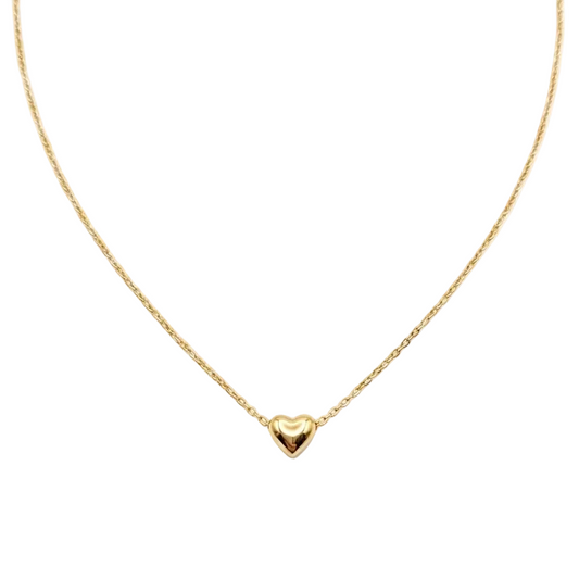 Gold heart-shaped pendant necklace on a white background