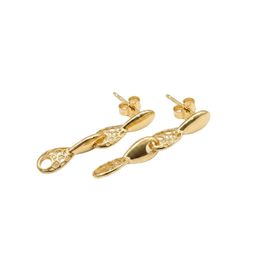 Gold earrings on a white background