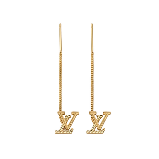 Gold earrings with 'V' design on a white background