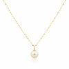 Gold necklace with a single pearl pendant on a white background
