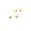 Gold stud earrings with round diamond settings on white background