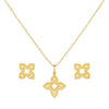 Gold necklace with matching earrings on a white background