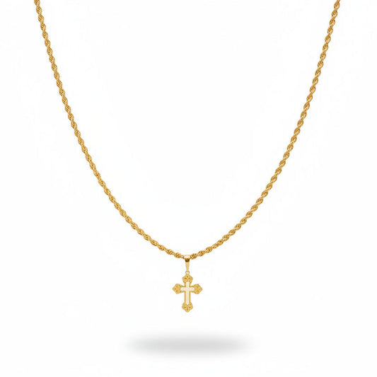 Gold necklace with cross pendant on a black velvet stand