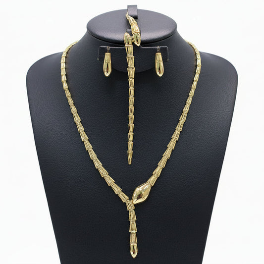 Gold necklace, bracelet, earrings, and ring set on a black mannequin with weight details.