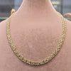 Gold chain necklace on a person's neck with measurements displayed.