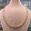 Gold necklace on a mannequin with weight and length information displayed.