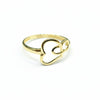 Gold ring with heart design on a gray background