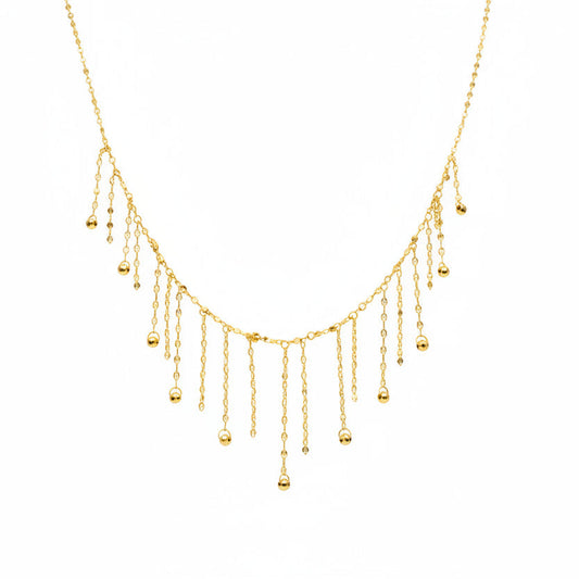 Delicate gold necklace on a mannequin with weight and code information.