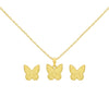 Gold butterfly necklace, pendant, and earrings on a white background
