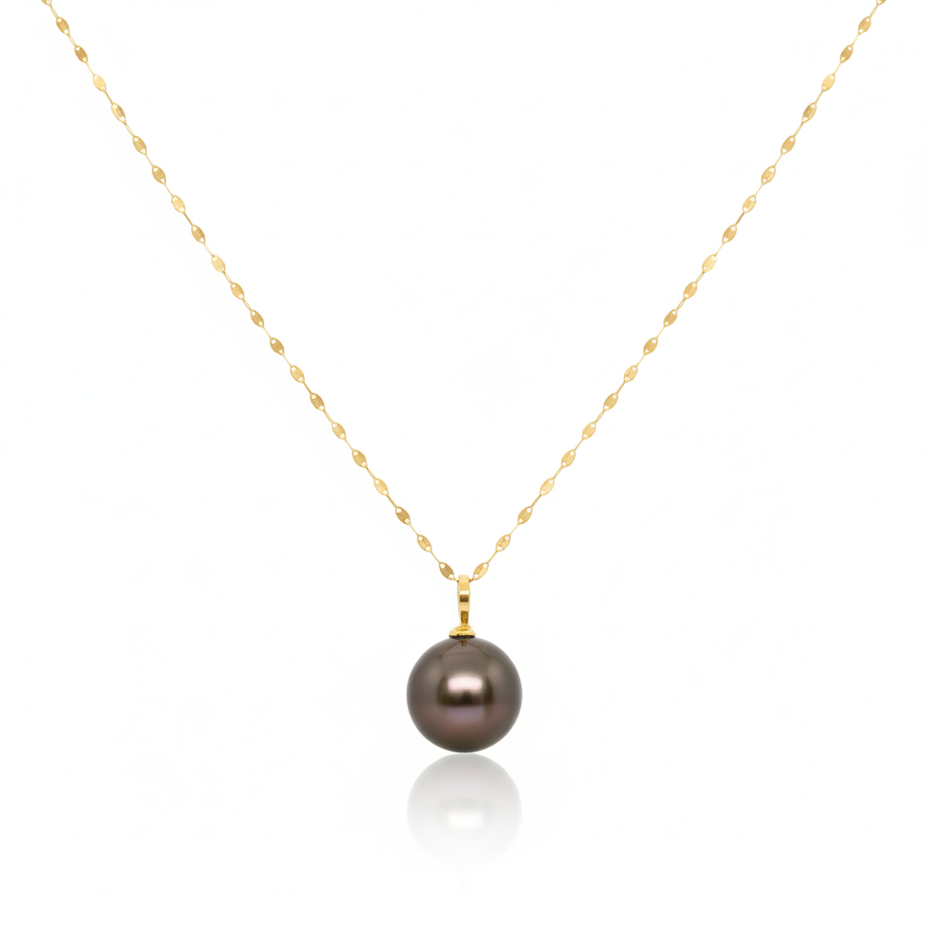 Gold necklace with a dark pearl pendant on a white background