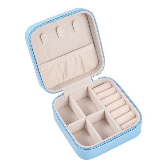 Open jewelry case with compartments on a light gray background