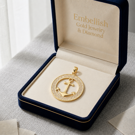 Gold anchor pendant in a 'Embellish Gold Jewelry & Diamond' box on a light background