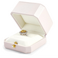 Open jewelry box with a ring and earrings on a white background