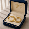 Gold hoop earrings in a 'Embellish Gold Jewelry & Diamond' box on a neutral background