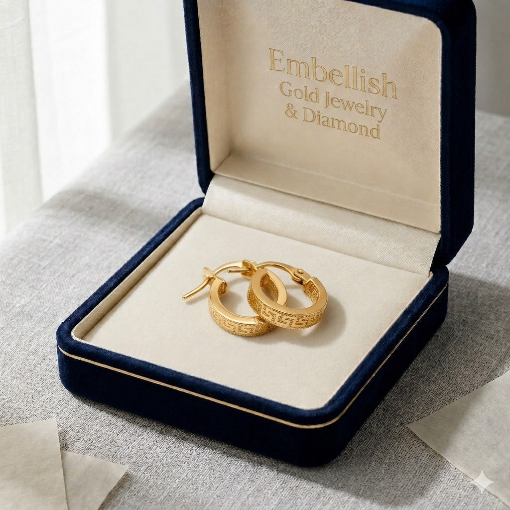 Gold hoop earrings in a jewelry box with 'Embellish Gold Jewelry & Diamond' branding.