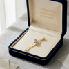 Gold jewelry with gemstones in a 'Embellish Gold Jewelry & Diamond' box.