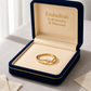 Gold ring in a 'Embellish Gold Jewelry & Diamond' box on a textured surface.