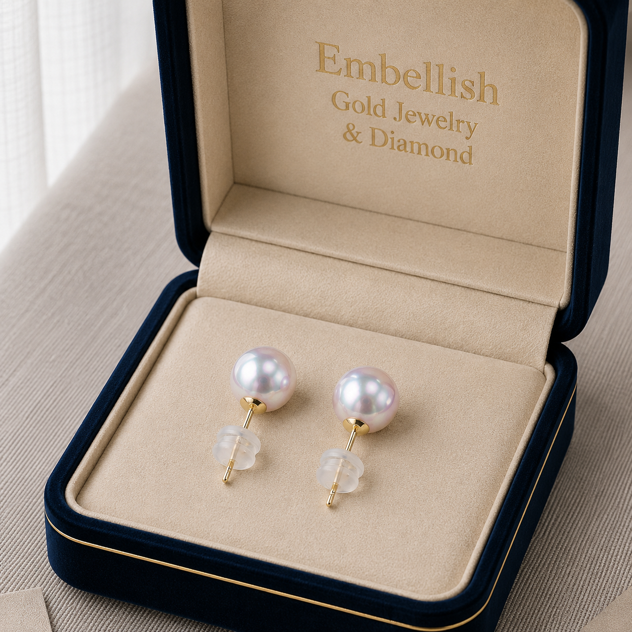 Pearl earrings in a 'Embellish Gold Jewelry & Diamond' jewelry box.
