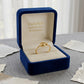 Gold ring in a blue jewelry box with 'Embellish Gold Jewelry & Diamond' branding.