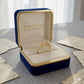 Gold ring in a blue and gold jewelry box with 'Embellish Gold Jewelry & Diamond' text.