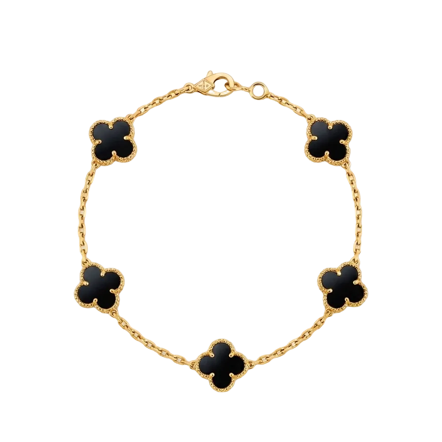 Gold bracelet with black clover-shaped charms on a white background