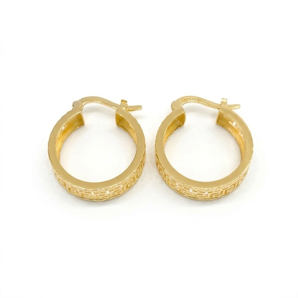 Pair of gold hoop earrings on a white background