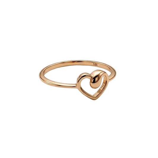Rose gold ring with a heart design on a light gray background