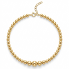 Gold beaded necklace on a white background