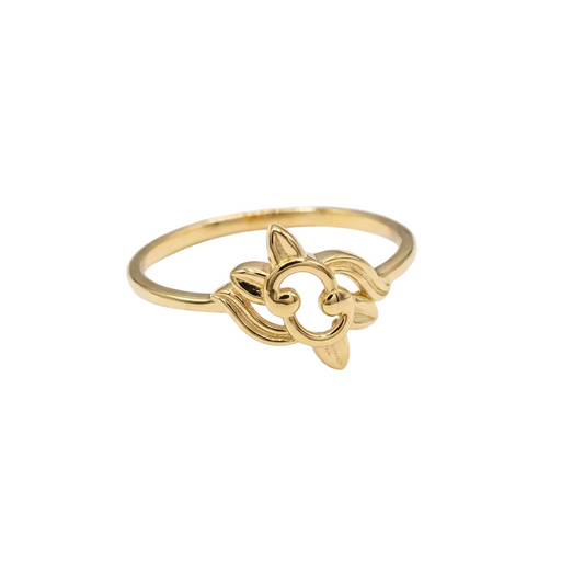 Gold ring with a floral design on a white background