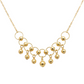 Gold necklace with circular links and spherical pendants on a transparent background