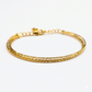 Gold bracelet on a white background