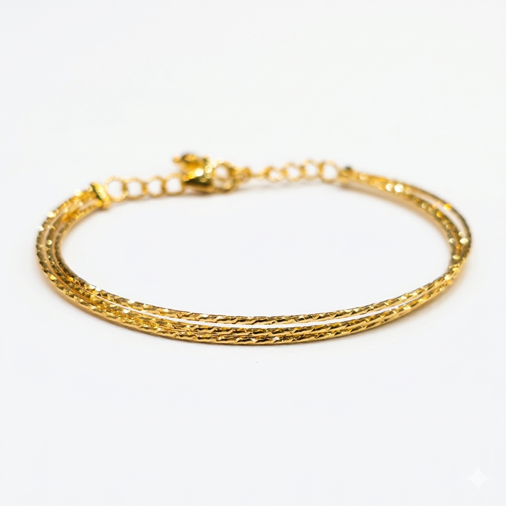 Gold bracelet on a white background